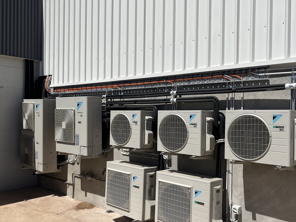 Bank of Daikin outdoor units installed by Pristine Cooling on a Goldfields commercial site
